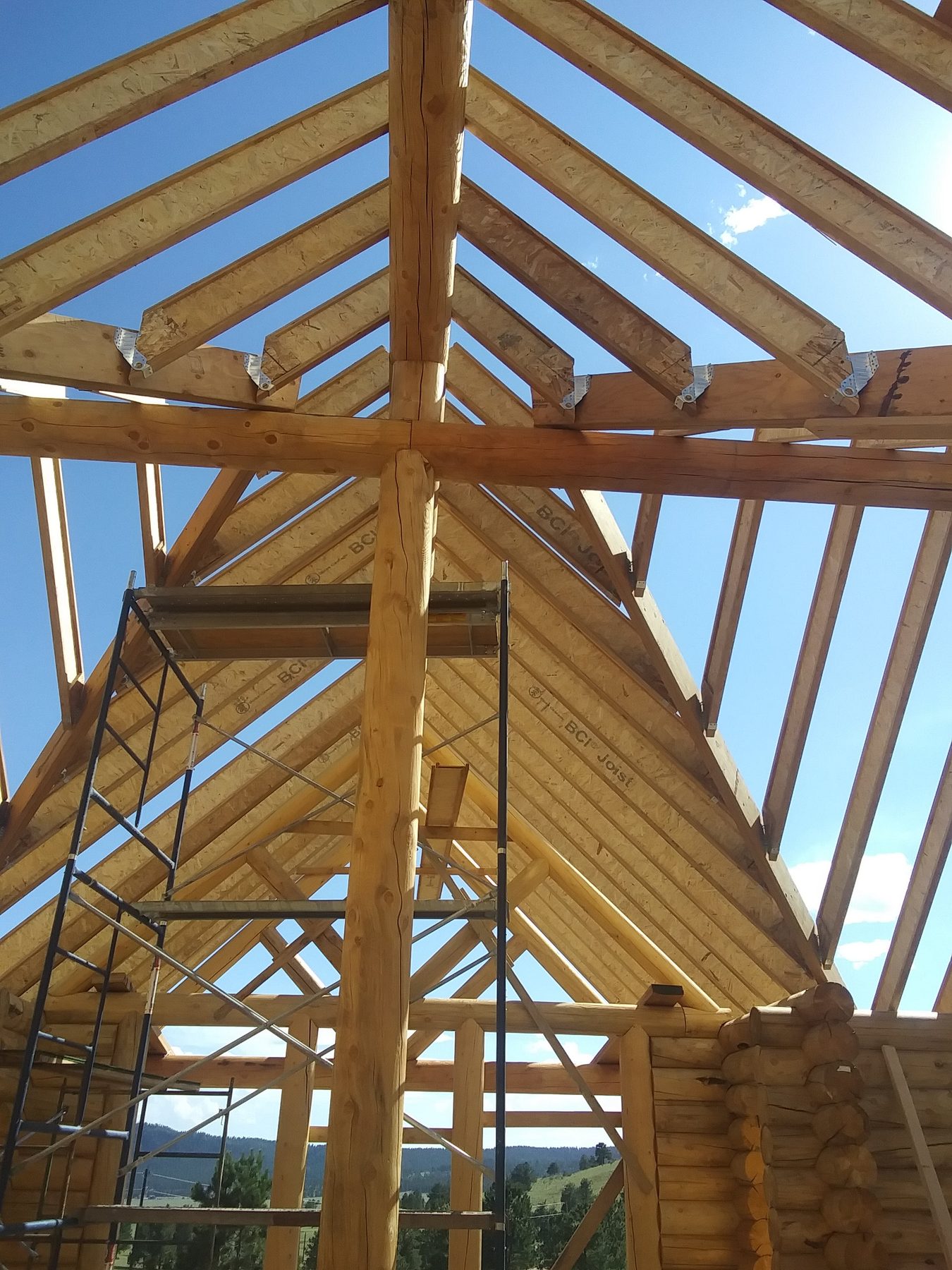 Rafter framing seen from inside the open gable.