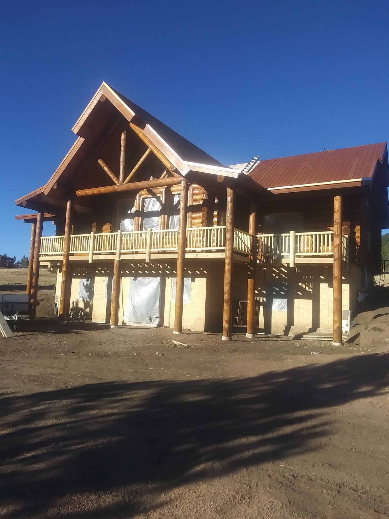The gable end with its window wall and covered deck below.