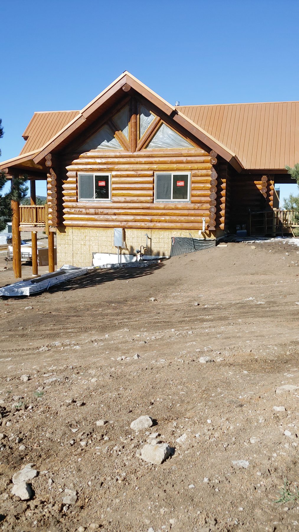 Three-quarter view of the finished exterior from the drive.