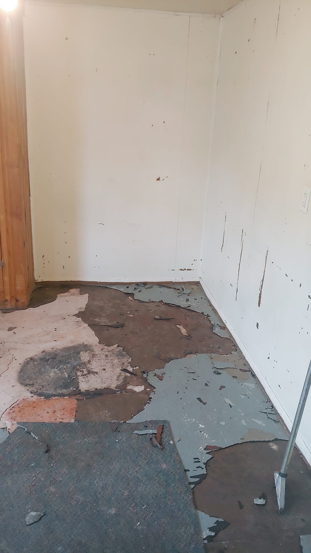 Before: floor covering stripped back to patched subfloor.