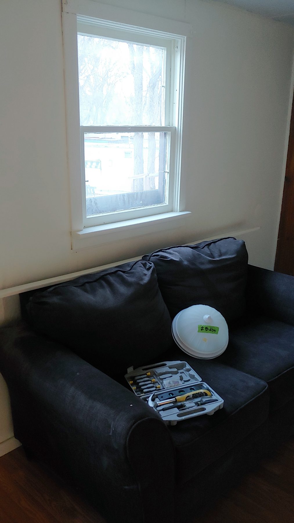 After: the living room finished, with light from the new window wall.
