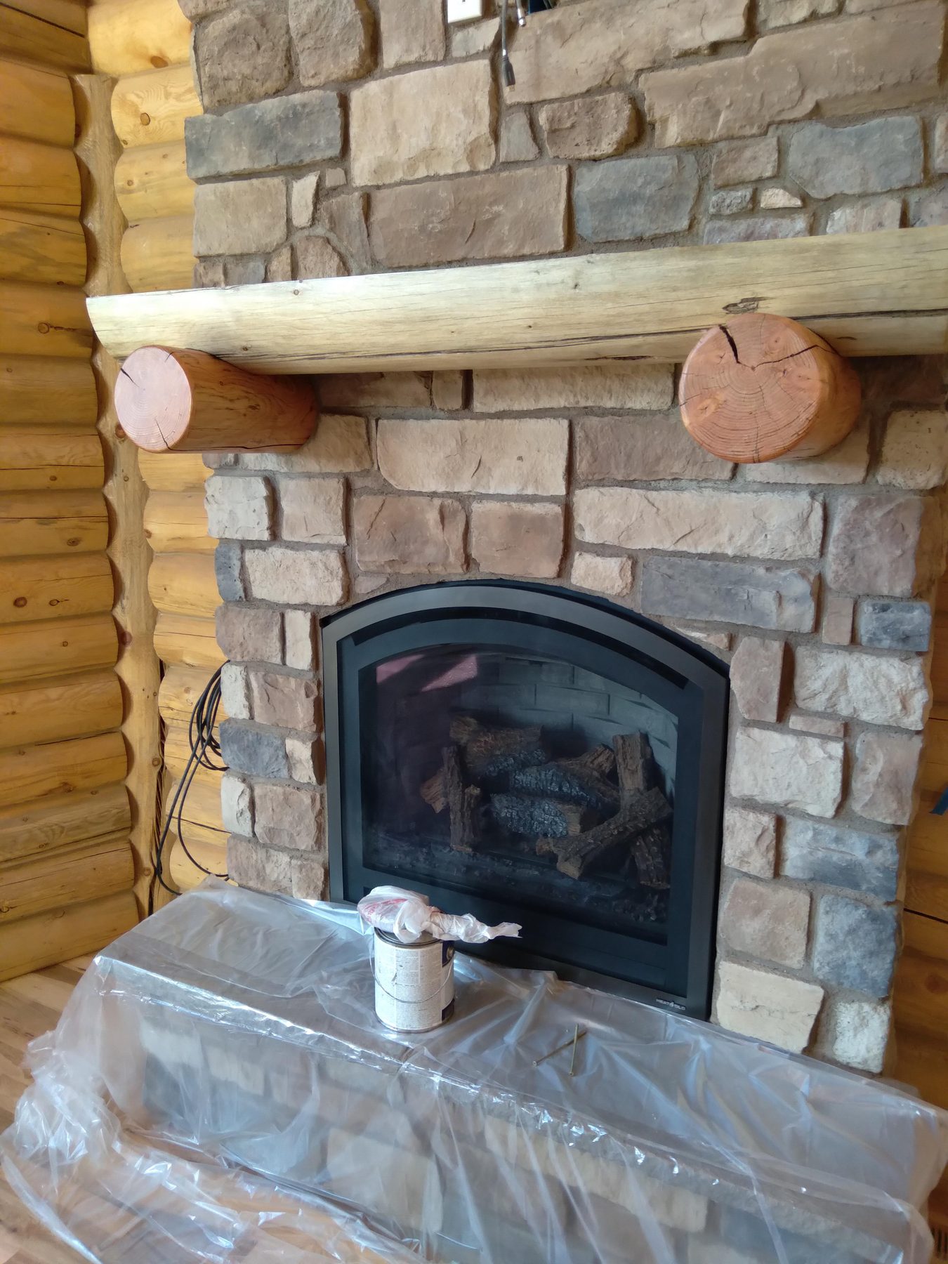 The finished fireplace with mantel and hearth in place.